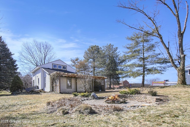 view of front of home with an outdoor fire pit