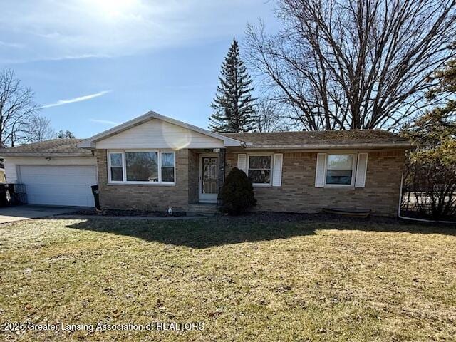 ranch-style home with brick siding, an attached garage, driveway, and a front lawn