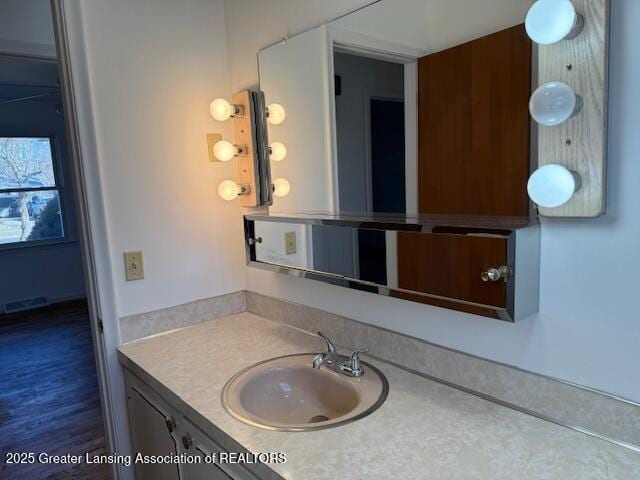 bathroom featuring visible vents and vanity