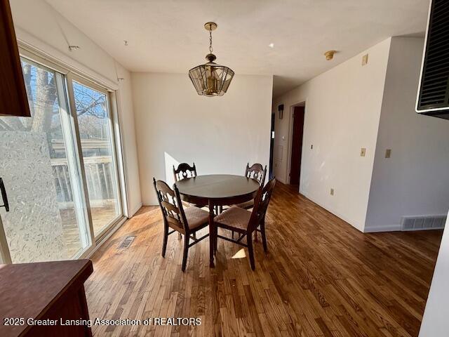 dining room with visible vents and light wood finished floors