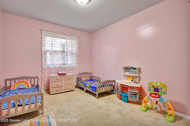 bedroom featuring baseboards and carpet floors