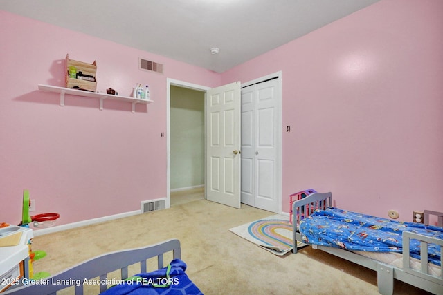 bedroom featuring visible vents, carpet flooring, and baseboards