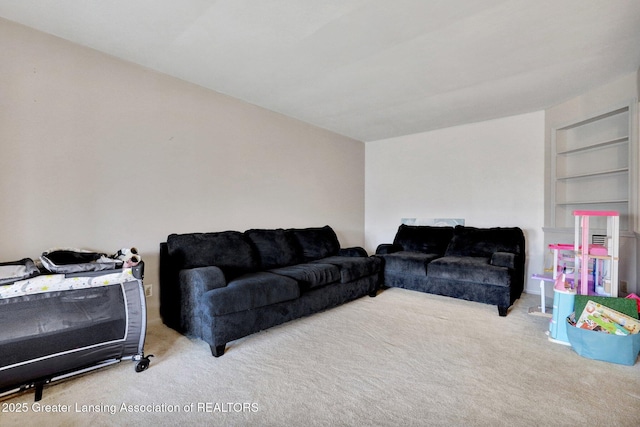 carpeted living room featuring built in features