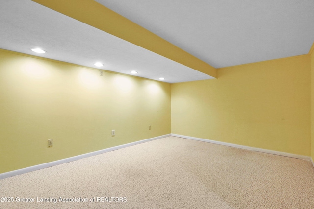 finished below grade area featuring recessed lighting, carpet, and baseboards