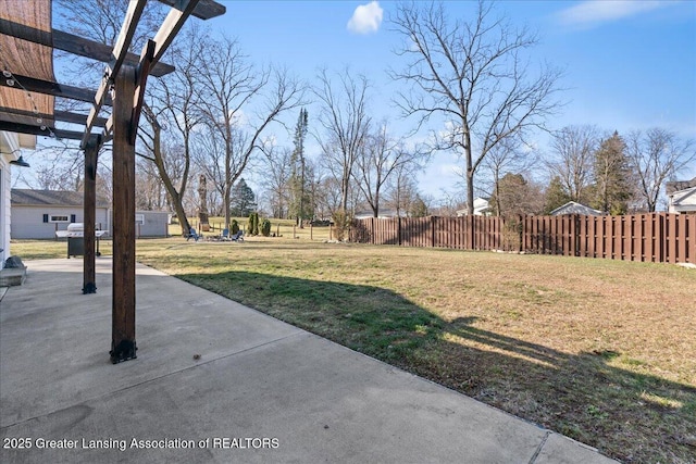 view of yard with a patio and fence