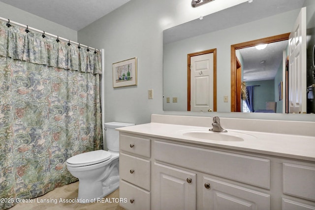 full bath with a shower with shower curtain, toilet, and vanity