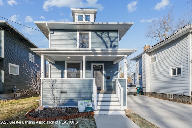 traditional style home featuring a porch and concrete driveway