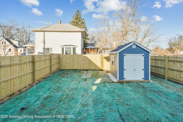 view of shed featuring a fenced backyard