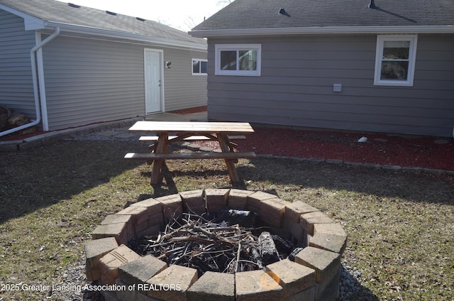 view of yard with an outdoor fire pit