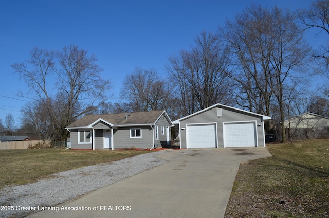 single story home featuring an outdoor structure, a garage, and a front yard