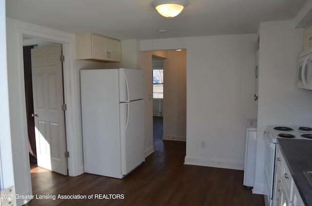 kitchen with baseboards, white appliances, dark wood-style flooring, and white cabinetry