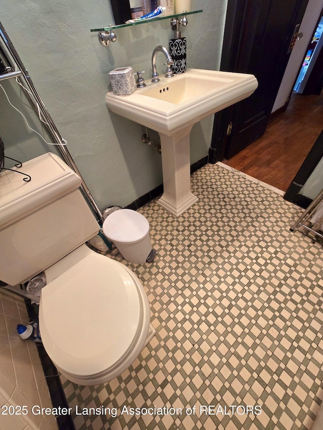 bathroom with a sink and toilet