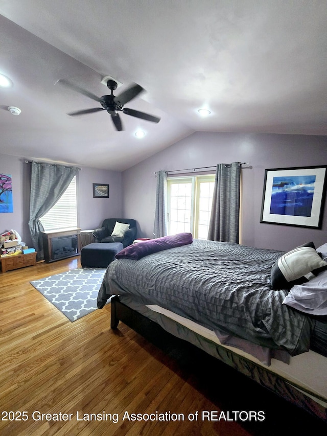 bedroom with vaulted ceiling, recessed lighting, ceiling fan, and wood finished floors