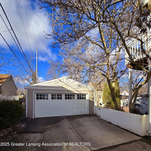 detached garage with fence