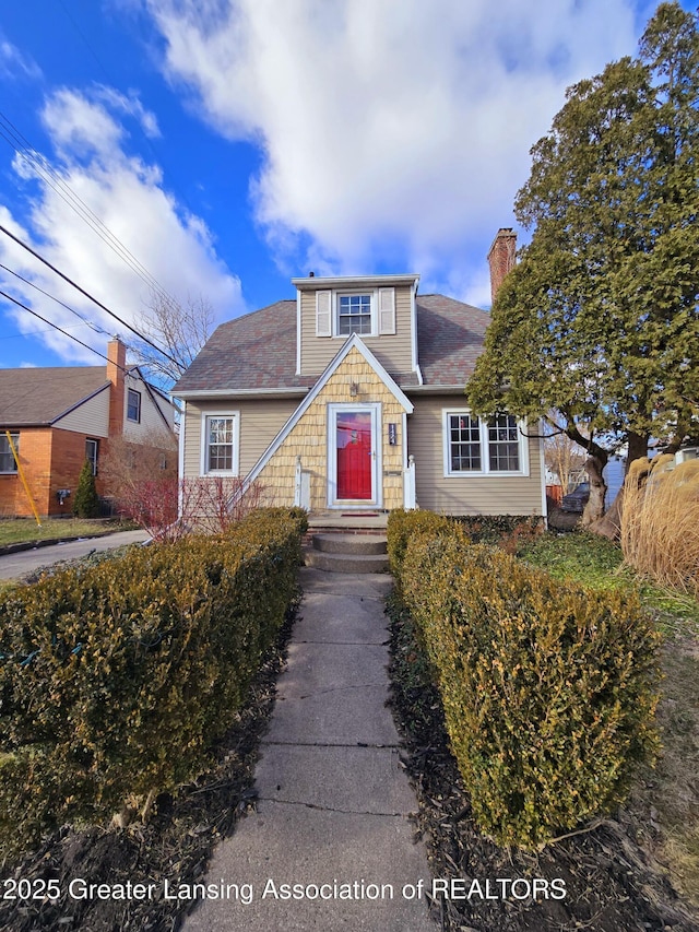 view of front of home featuring a chimney