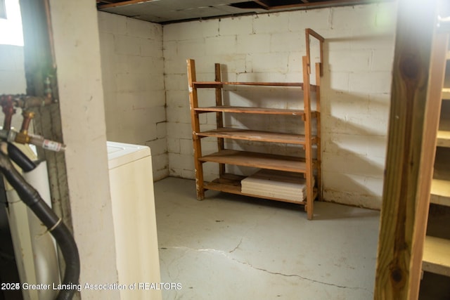 unfinished basement with concrete block wall