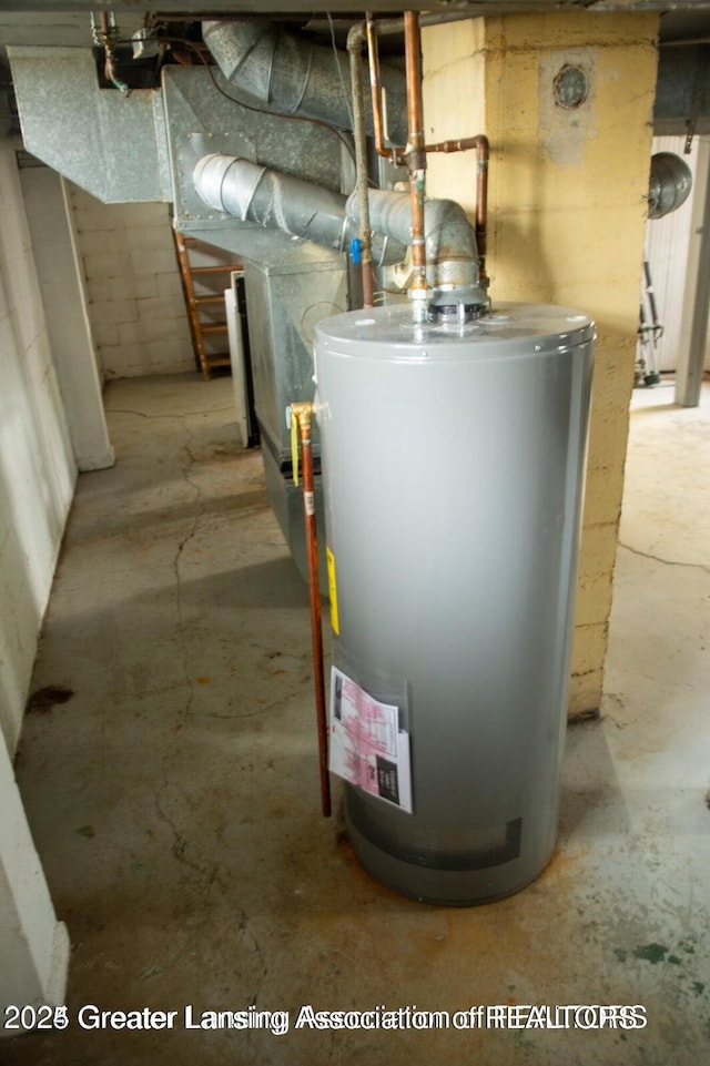 utility room featuring gas water heater