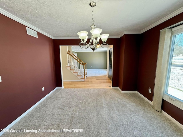 unfurnished dining area featuring a wealth of natural light, visible vents, carpet, and an inviting chandelier