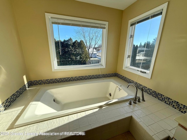 bathroom with a garden tub