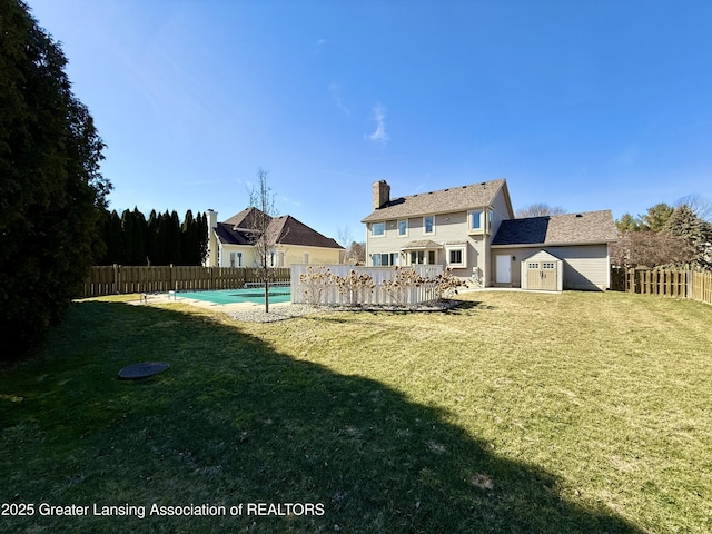 exterior space with a fenced in pool and a fenced backyard