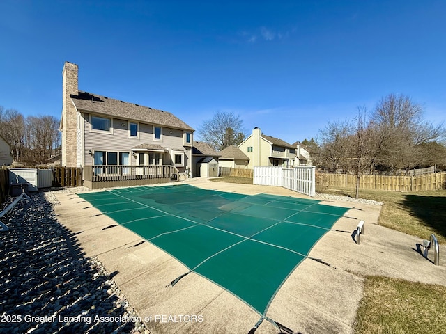 view of pool with a fenced in pool, a patio, and a fenced backyard