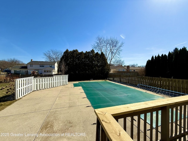 view of pool with a fenced backyard, a fenced in pool, and a patio