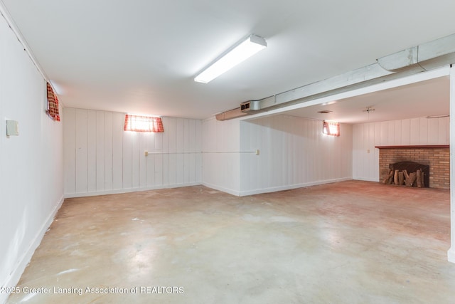 finished basement featuring a fireplace