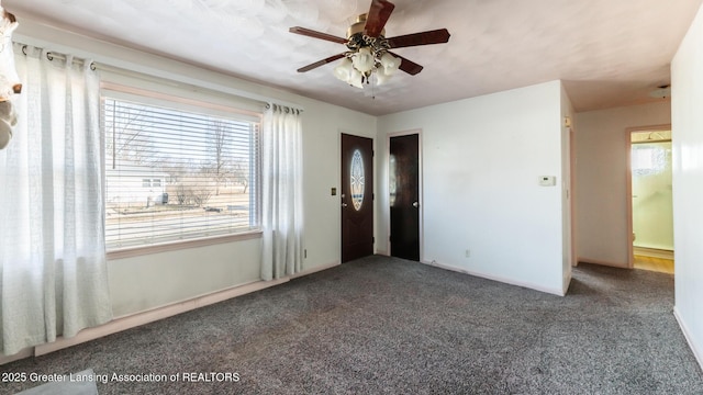 unfurnished bedroom with ceiling fan and carpet flooring