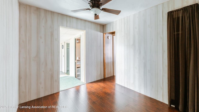 unfurnished room featuring a ceiling fan and hardwood / wood-style floors