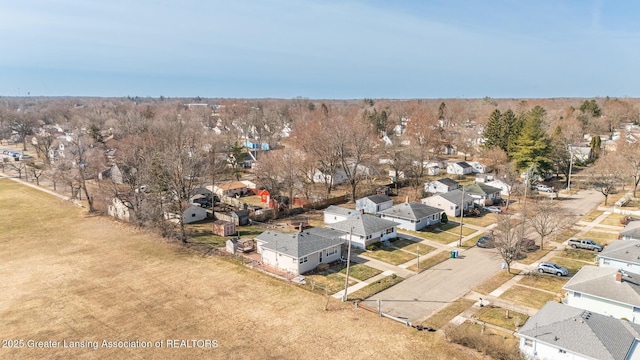 birds eye view of property with a residential view