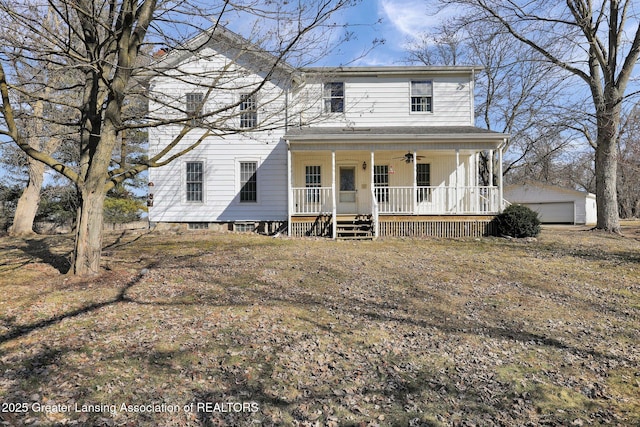 view of front of home featuring a porch, an outdoor structure, and a ceiling fan