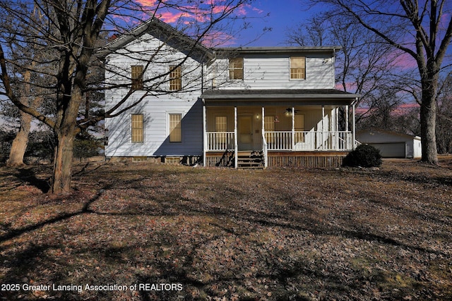 view of front of house with an outbuilding and covered porch