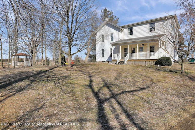 view of front of home featuring a gazebo, a porch, and a ceiling fan