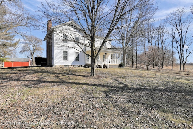 view of yard with covered porch