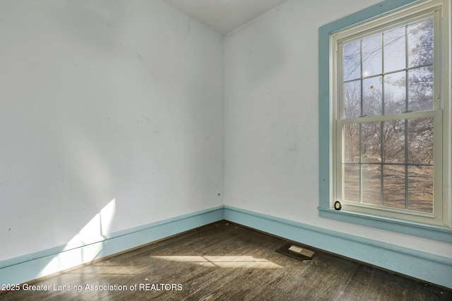 spare room featuring hardwood / wood-style flooring