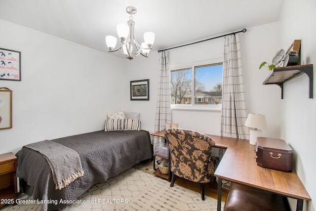 bedroom featuring an inviting chandelier