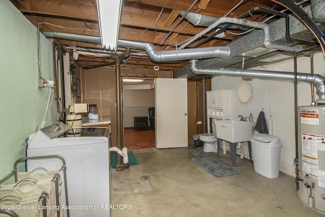 unfinished below grade area with washer / dryer, gas water heater, and a sink