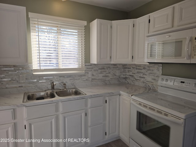 kitchen with a sink, decorative backsplash, white appliances, and white cabinetry