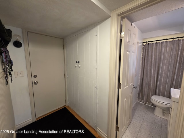 hallway featuring light tile patterned floors