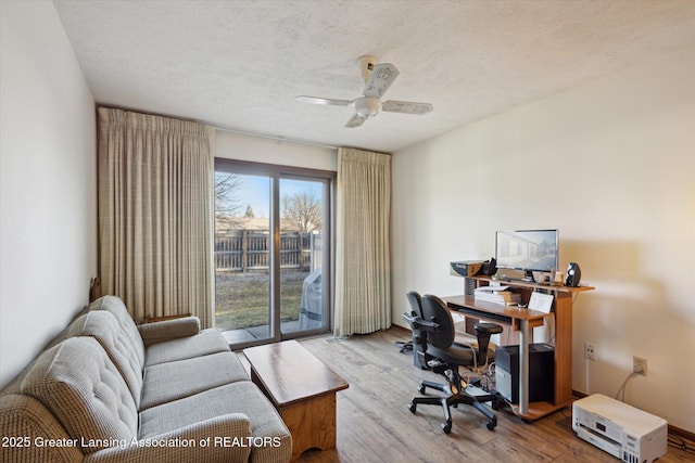 office area featuring ceiling fan, a textured ceiling, and wood finished floors