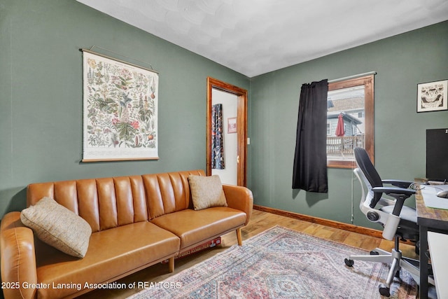 office with baseboards and wood finished floors