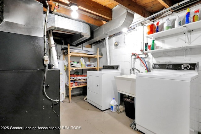 unfinished basement with gas water heater, heating unit, and washer and clothes dryer