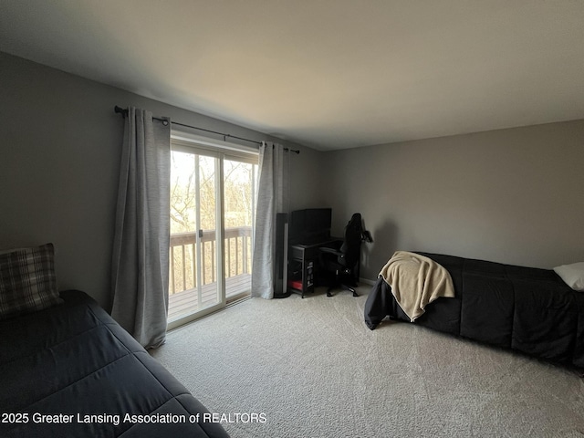 carpeted bedroom featuring access to outside