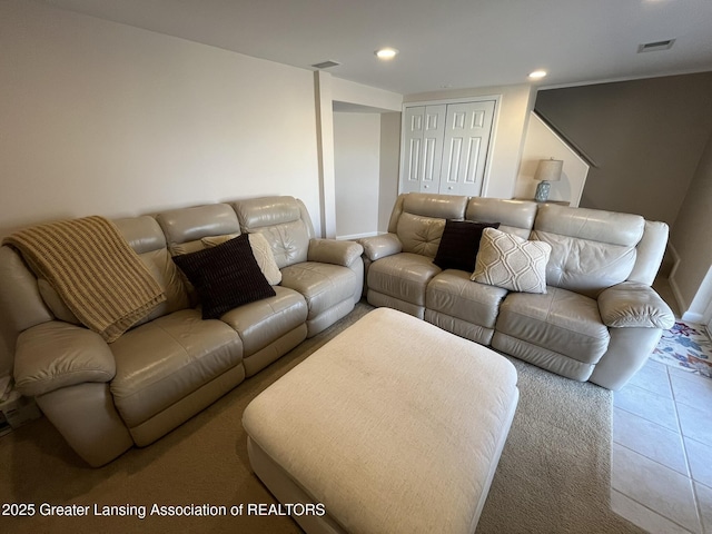 tiled living room with visible vents and recessed lighting