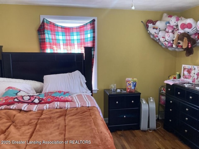 bedroom with wood finished floors