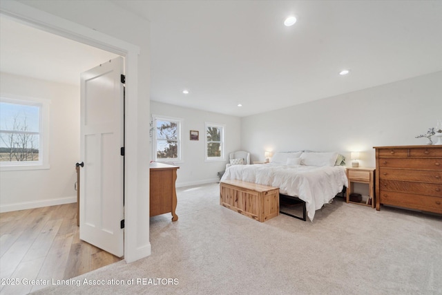 bedroom with multiple windows, recessed lighting, and baseboards