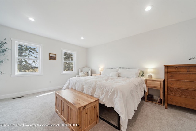 bedroom featuring recessed lighting, visible vents, baseboards, and light colored carpet