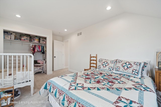 bedroom featuring visible vents, vaulted ceiling, carpet floors, recessed lighting, and a closet