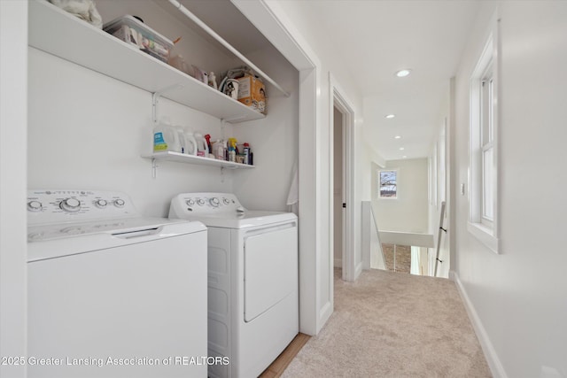 clothes washing area with recessed lighting, baseboards, independent washer and dryer, and light carpet