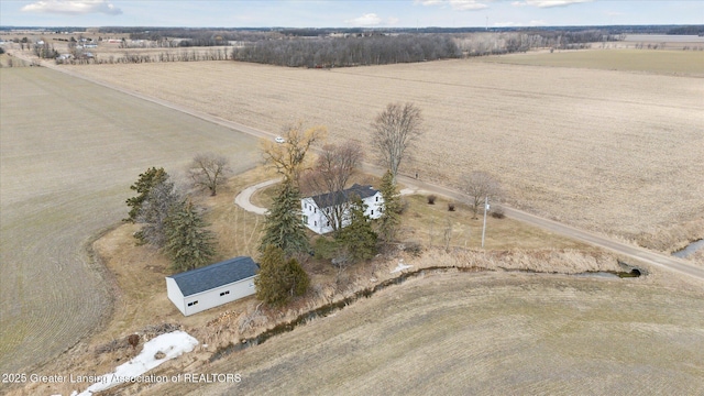 birds eye view of property with a rural view